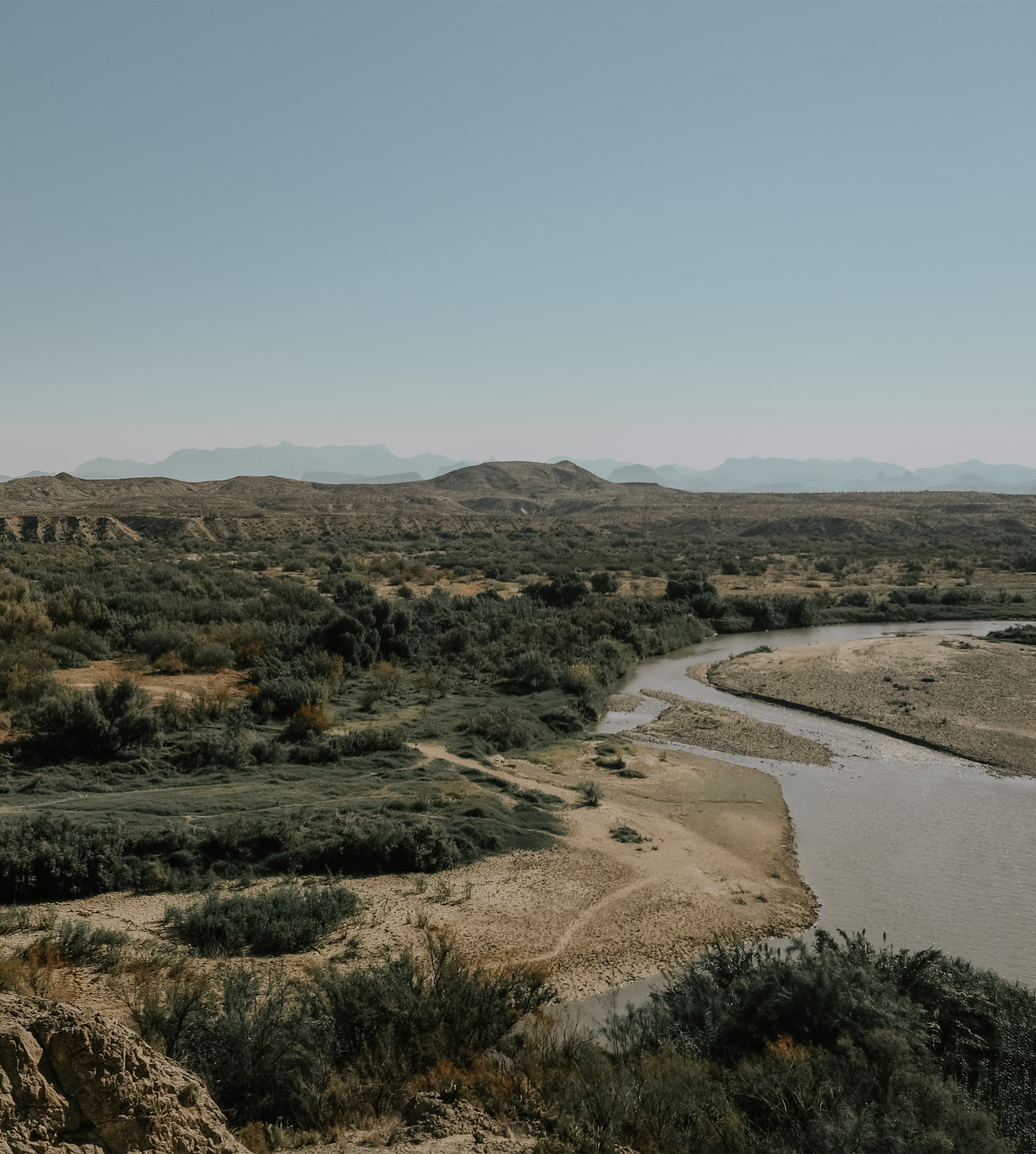 The Rio Grande winding out of Santa Elena Canyon through the Big Bend desert