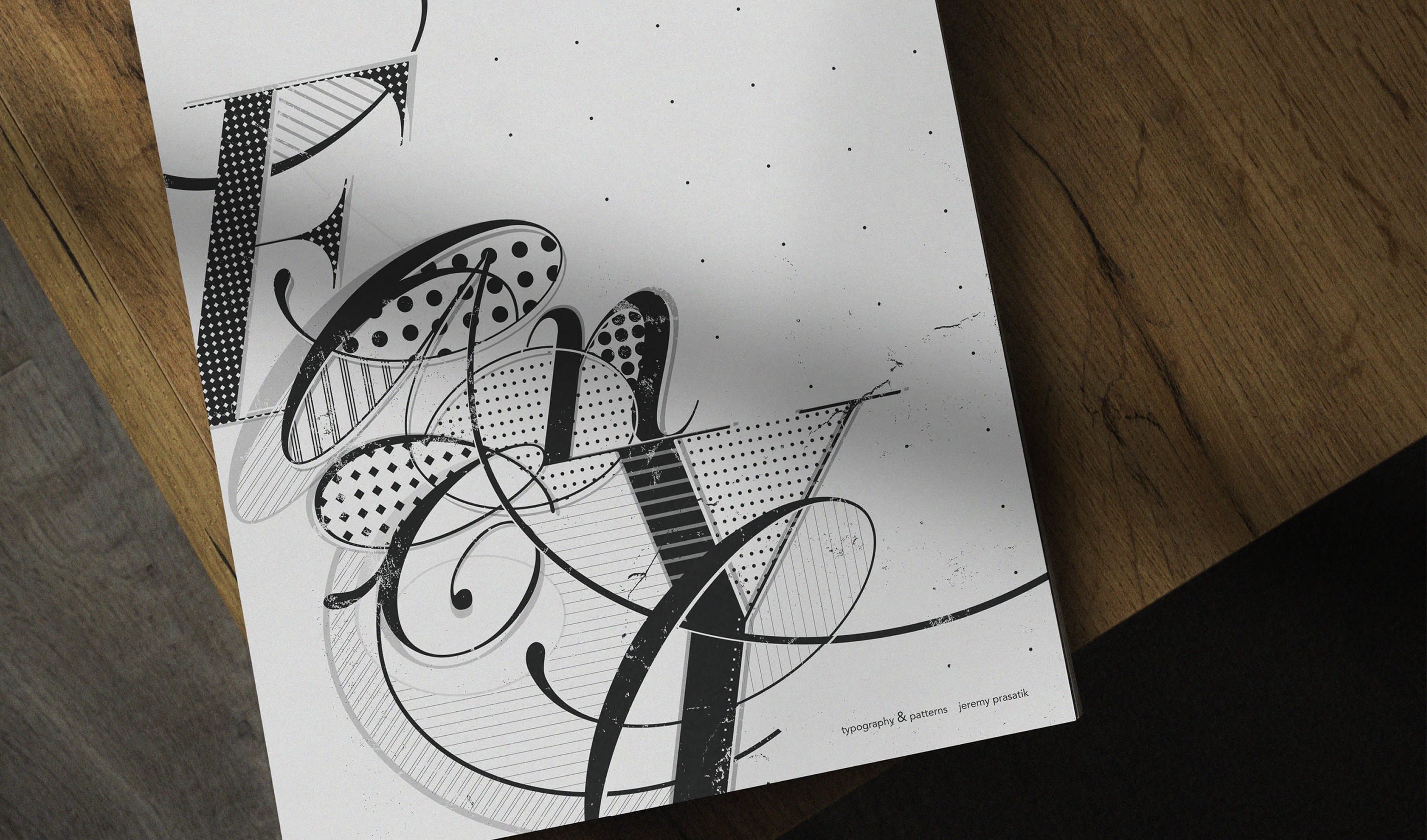 Typography & Patterns poster on wood surface, expressive letterforms filled with black and white patterns