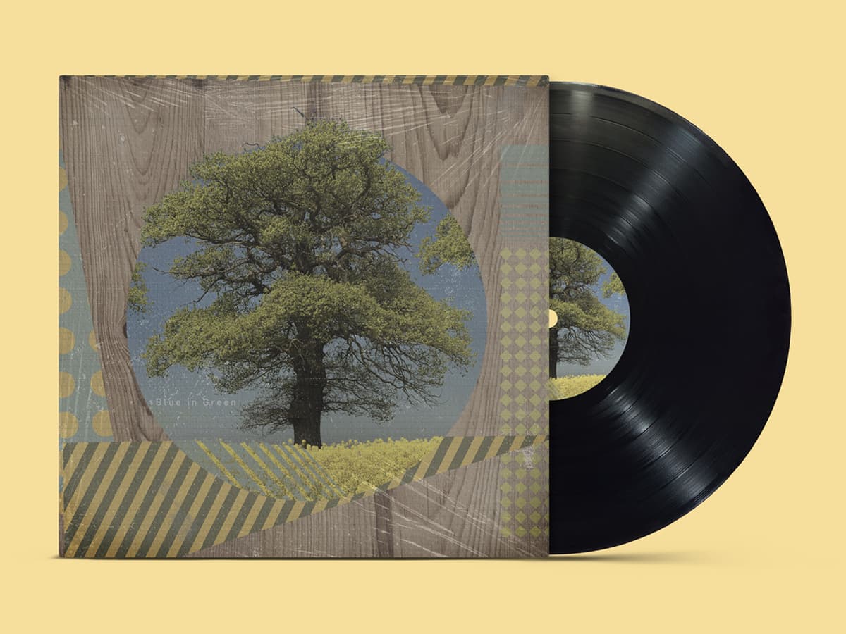 Blue in Green album cover, tree silhouette over woodgrain with collage textures, vinyl sleeve mockup