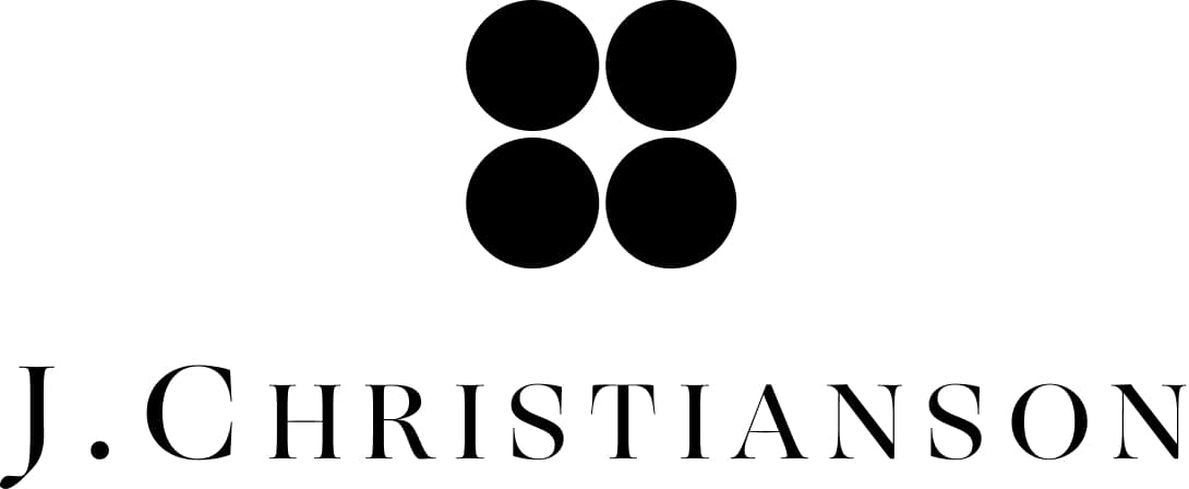 J. Christianson logo, four-circle dot mark above engraved serif wordmark