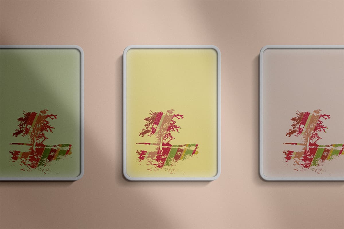 Tree silhouette print color study, three framed prints on blush wall