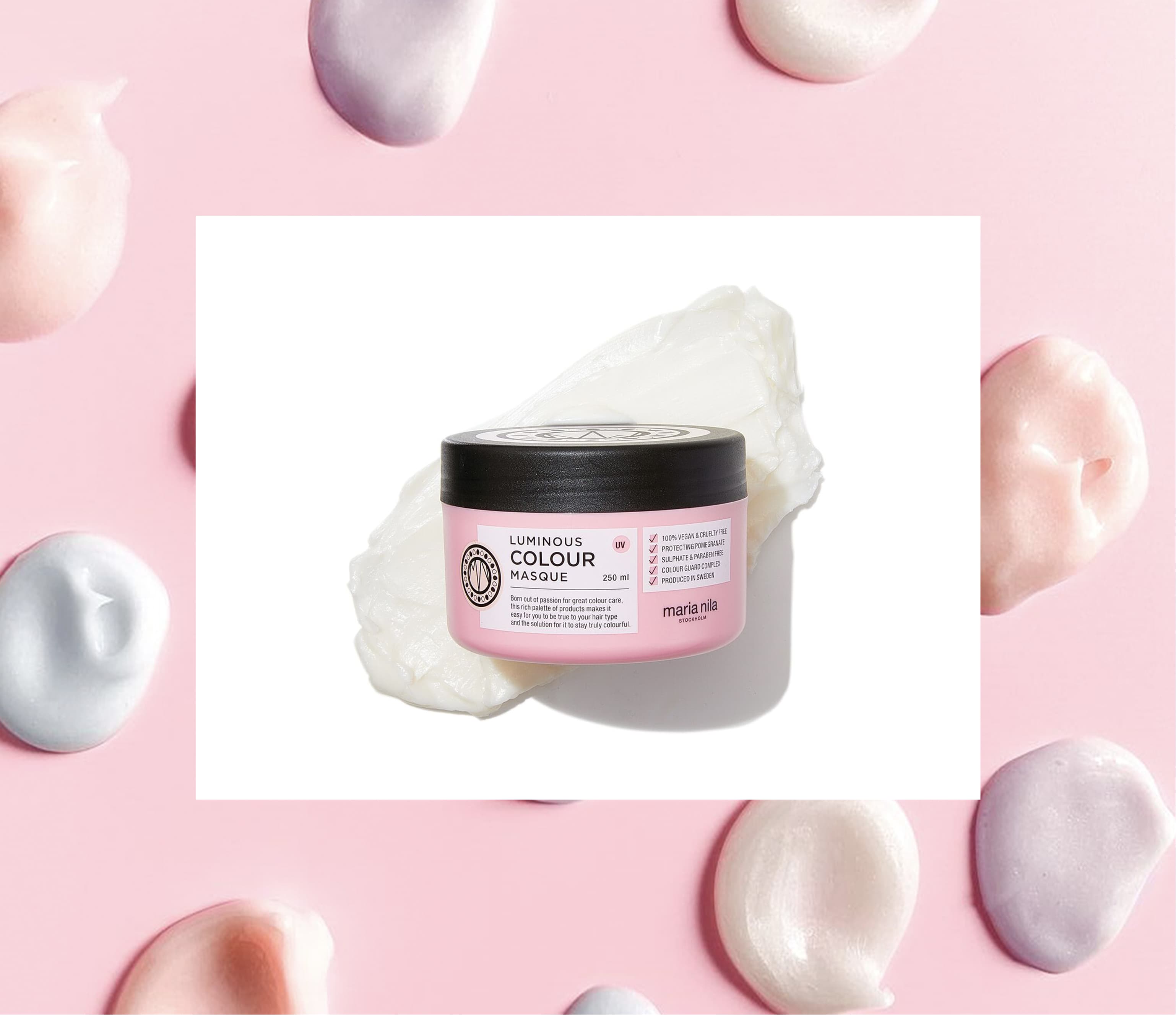 Maria Nila Colour Masque product photography on cream-and-blush ground with splattered pearl droplets framing the jar