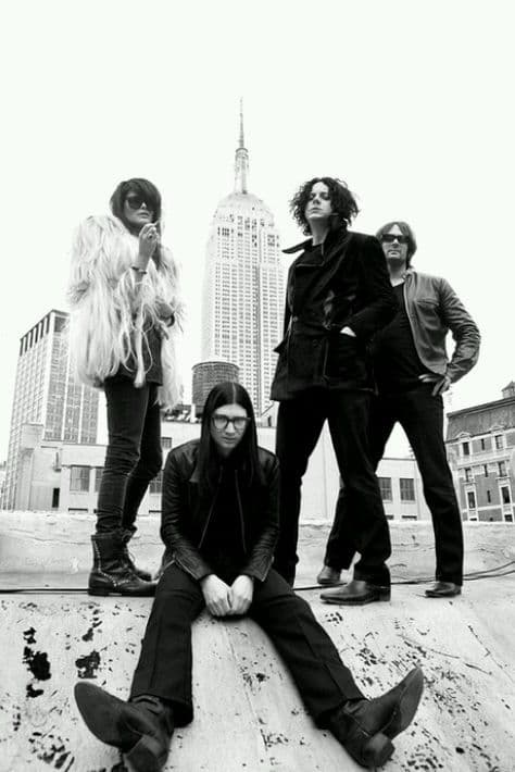 Black-and-white band portrait on a rooftop with the Empire State Building behind