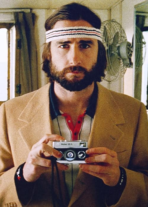 Royal Tenenbaums film still, Richie with camera, headband, and beard