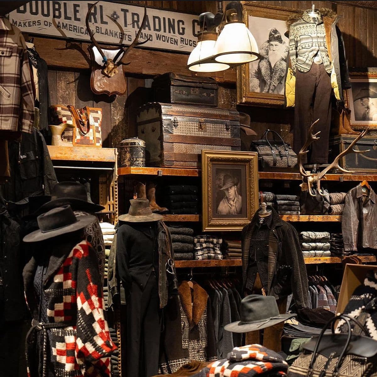 Double RL store interior with antlers, vintage trunks, knit hats, and a gallery wall