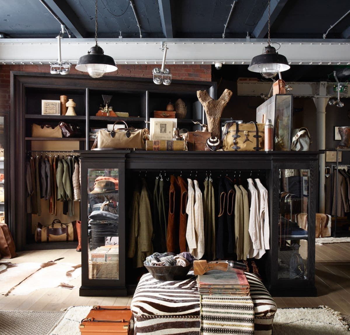 Vintage clothing store interior with zebra-print ottoman and dark cabinetry