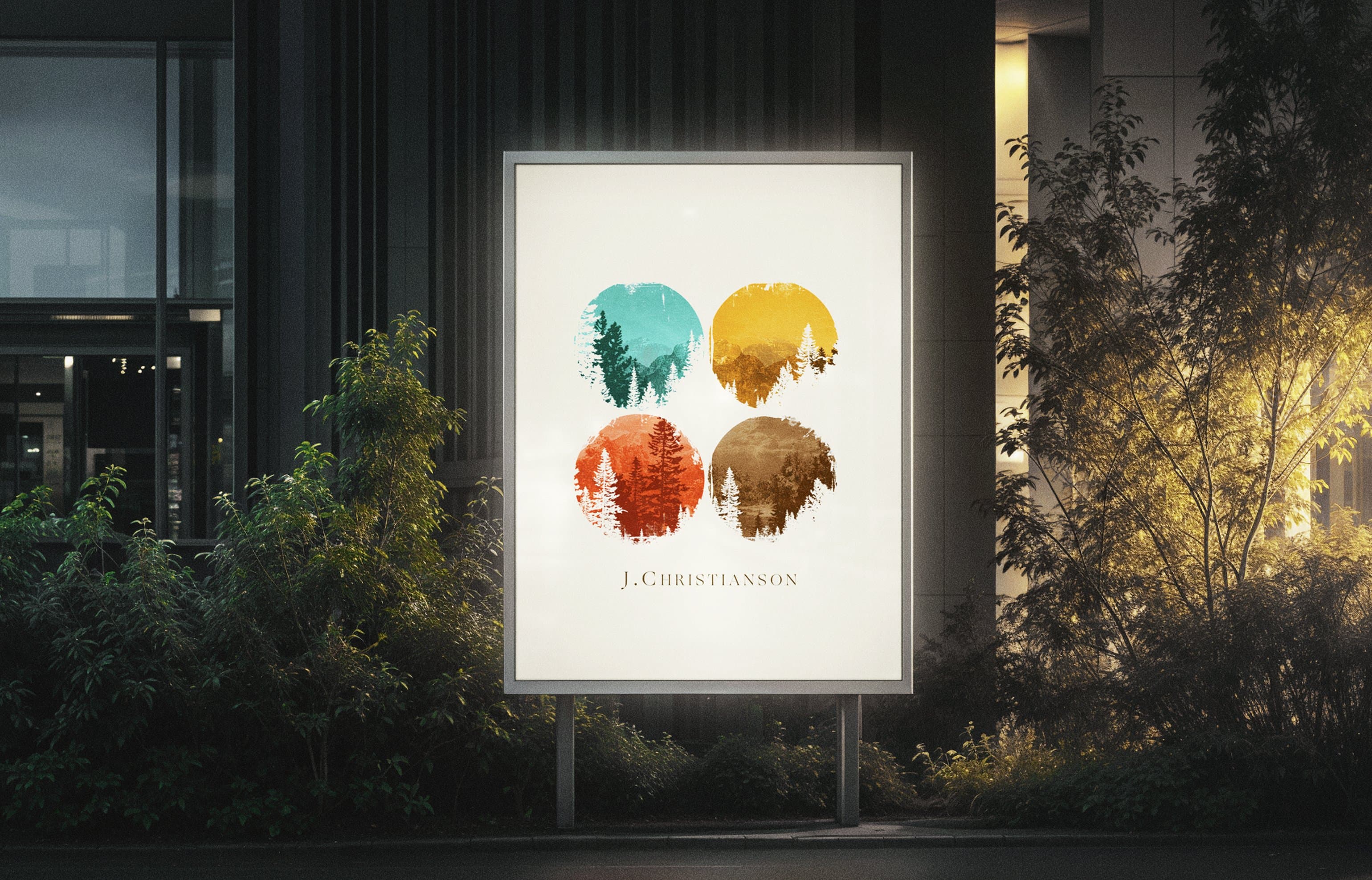 J. Christianson outdoor sign mockup, four seasonal tree circles, evening lighting