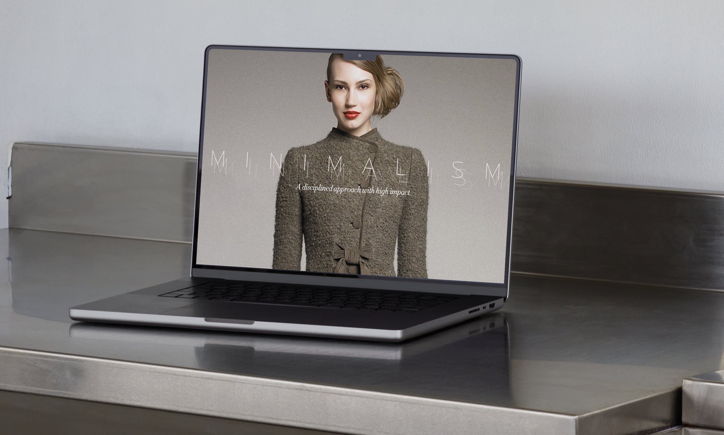 Neiman Marcus InSite Minimalism story on laptop against stainless steel surface