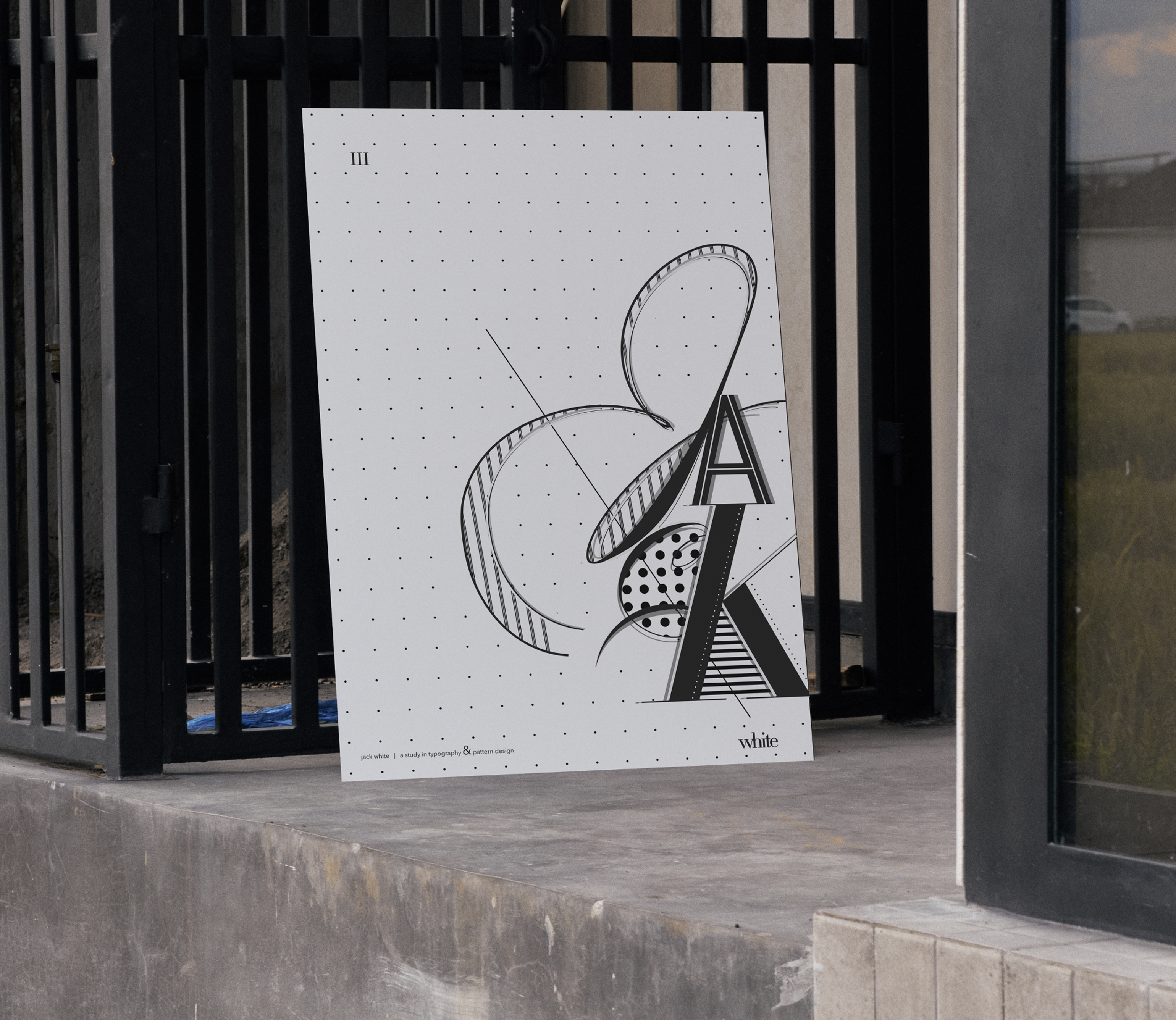 Typography & Patterns, white art print leaning against metal gate outdoors