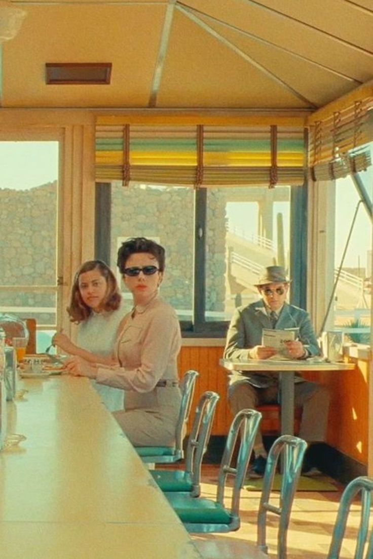 Asteroid City film still, three figures at a 1950s diner counter