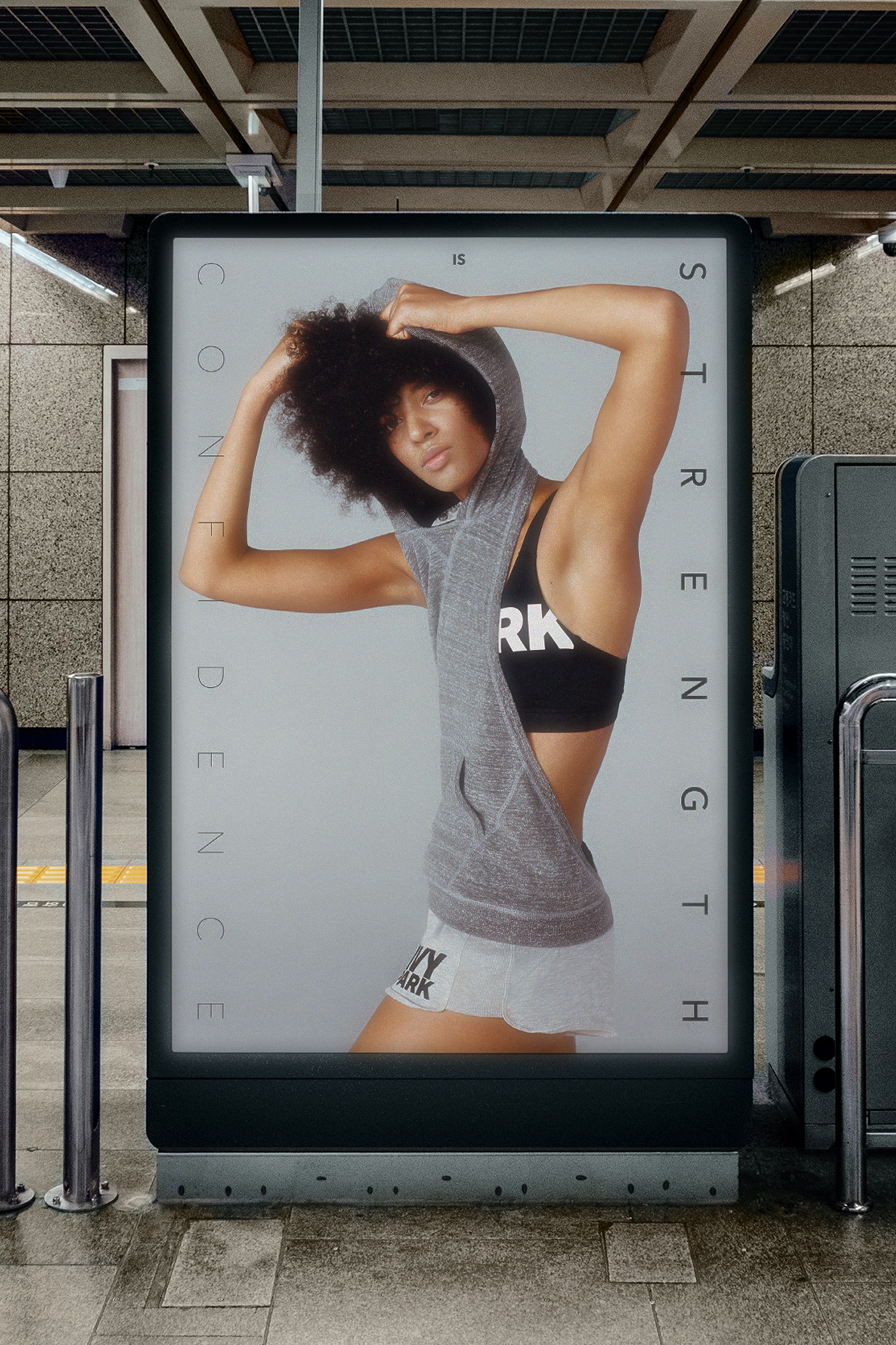 Ivy Park 'Confidence is Strength' typography system on a transit signage mockup